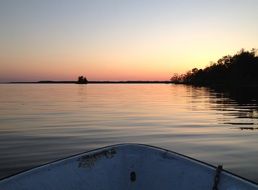 lake boat sunset