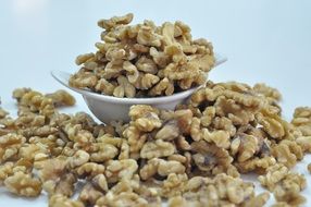 peeled natural walnuts in bowl