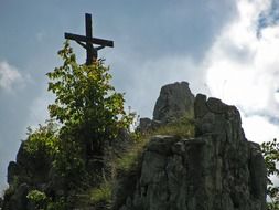 wooden cross on top of a mountain