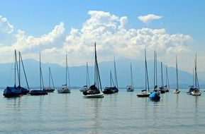 lake with sailing vessels on anchor