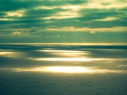 bright shine of the sun on the surface of the ocean