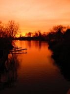 glow of orange sunset over the river