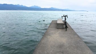 the bike is on the pier