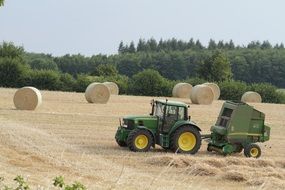 machine baling on the field