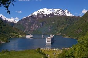 cruise ship among the fjords in Norway