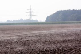 plowed field with fog