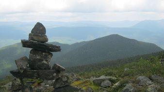 Landscape of inukshuk statue on a mountain