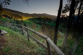 south tyrol autumn forest wooden fence in front