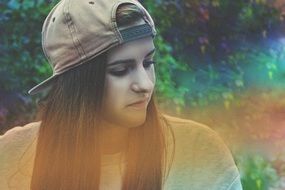 young woman in baseball cap