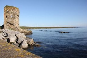 ruined tower at coastline, ireland