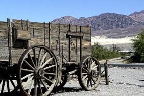 Wooden antique wagon in the desert