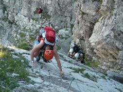 young people climbing rock