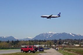 Airplane is flying over the airport