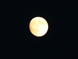 bright Full moon in the dark sky at night