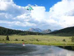 water carrier helicopter in the summer sky