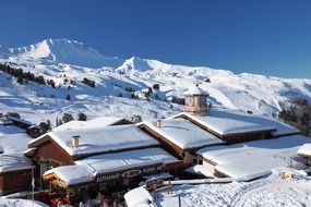 snow on the roofs of houses in the Alps