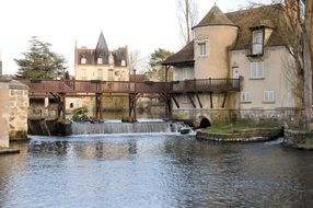 Landscape of lake and architecture in old village in France