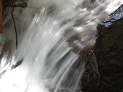 freezing water of a waterfall close-up