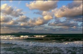 gray clouds over the restless sea