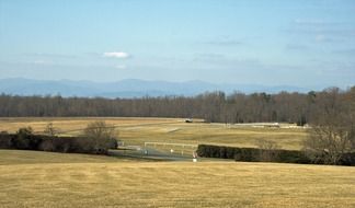 distant view of a wooden fence around a farm in virginia