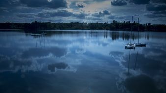 boats on a lake at night