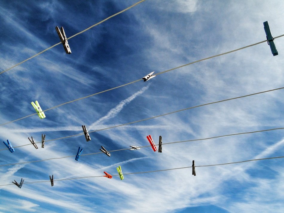 Clotheslines with clothespins against the sky