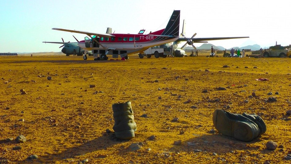 military boots at an airfield in the mountains