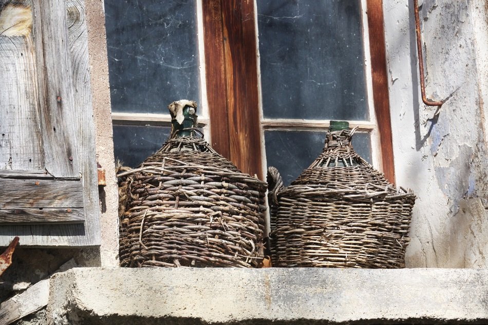 old wooden cylinders on the window