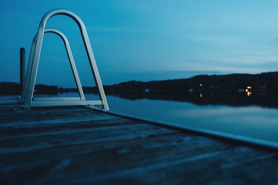 Ladder in the lake at dusk
