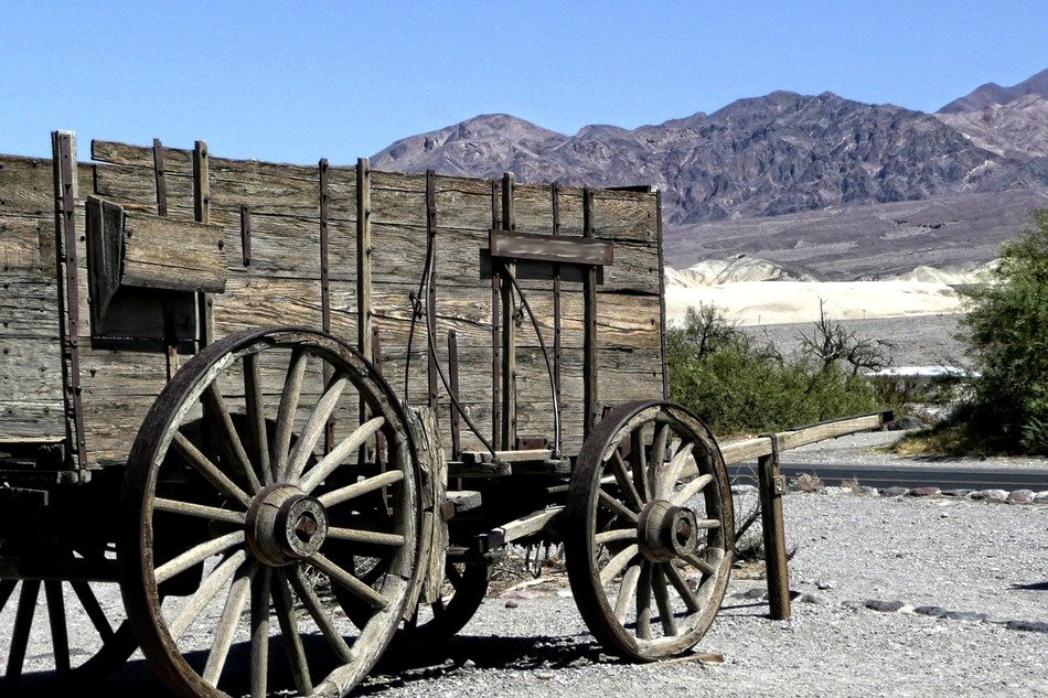 Wooden antique wagon in the desert