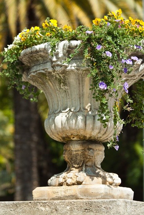 Close-up of the beautiful, antique vase with colorful flowers in Samoa