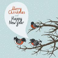 Three bullfinches sitting on the branches