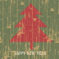 New year tree symbol with greetings on wooden planks texture