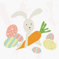 Easter bunny with carrot and decorated eggs