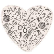 Heart symbol with sewing items
