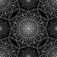 Openwork white pattern of mandalas