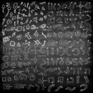 Vector hand drawn arrows icons set on the black blackboard