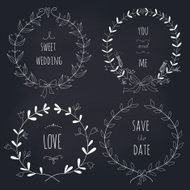 Hand drawn set of wedding wreaths on blackboard