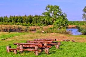 wooden benches near the pond as a place to relax