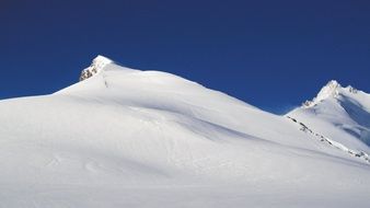 snowy ulrichshorn peak at sky, switzerland