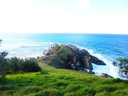 green coast and scenic cliff at sea