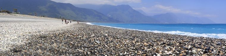 Landscape of the beautiful beach with stones near the mountains in Taiwan