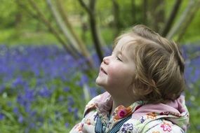 portrait of little girl looking up with a smile