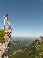 brave tourist on the peak of the mountain