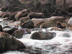 the river flows over the rocks in the Czech Republic