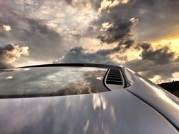 Sports car under dark clouds