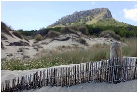 wooden fence on a sandy beach in Mallorca