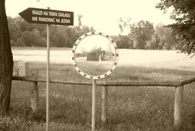 Mirror on a grass for viewing in monochrome
