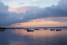 evening landscape with boats at bank