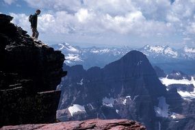 landscape of Climbers standing on the edge of a cliff